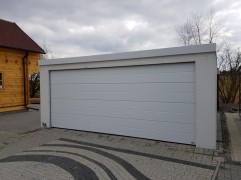 Монтирани двоен гараж с плосък покрив и мазилка